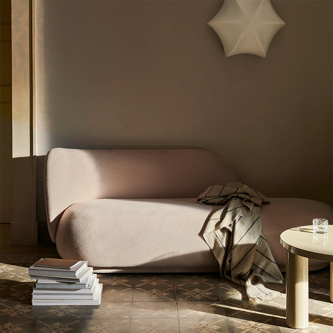 Boucle two-seat sofa in a warm living room