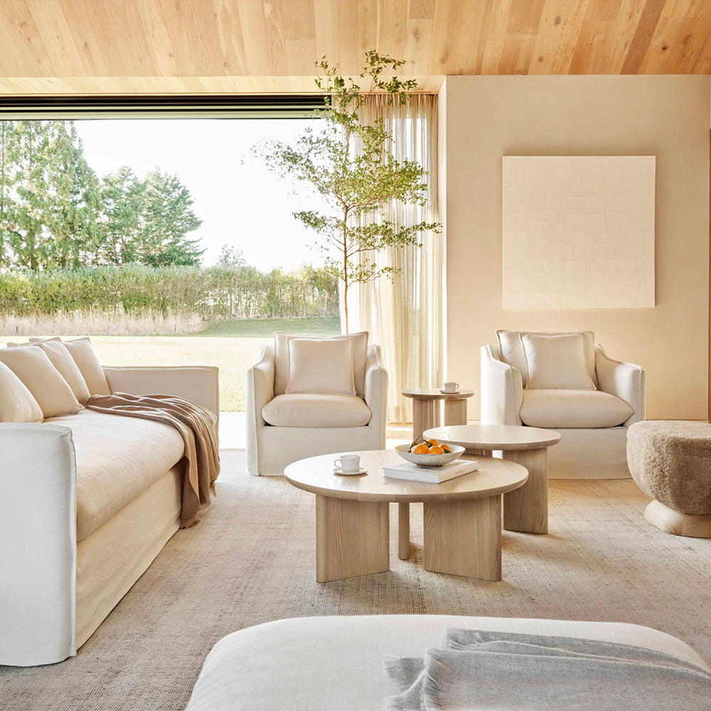 Living room with cream sofas and oak tables